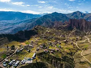 Overland Prints: Aerial view from the impressive landmark Muela del Diablo over the mountains down into the valley with the cities La