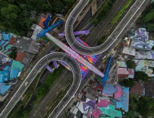 Aerial view of infinity sign traffic junction cross Jakarta a city of collaboartion road with car transport