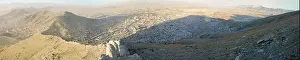 Conditions Prints: Aerial view of an informal settlement on the hillside of Kabul in Afghanistan with transmission towers on top of