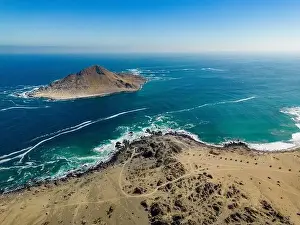 Greenish Prints: Aerial view of Isla Pan de Azúcar in the National Park Pan de Azúcar at the coast of the Atacama desert in Chile