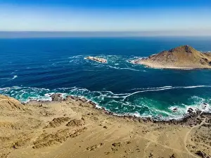 Greenish Prints: Aerial view of Isla Pan de Azúcar in the National Park Pan de Azúcar at the coast of the Atacama desert in Chile
