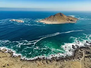 Greenish Prints: Aerial view of Isla Pan de Azúcar in the National Park Pan de Azúcar at the coast of the Atacama desert in Chile