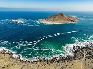Greenish Prints: Aerial view of Isla Pan de Azúcar in the National Park Pan de Azúcar at the coast of the Atacama desert in Chile
