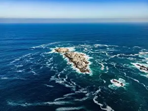 Greenish Prints: Aerial view of Isla Pan de Azúcar in the National Park Pan de Azúcar at the coast of the Atacama desert in Chile