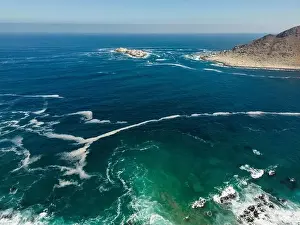 Greenish Prints: Aerial view of Isla Pan de Azúcar in the National Park Pan de Azúcar at the coast of the Atacama desert in Chile