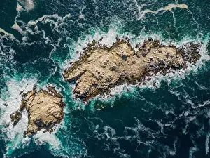 Greenish Prints: Aerial view of Isla Pan de Azúcar in the National Park Pan de Azúcar at the coast of the Atacama desert in Chile