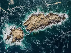 Brownish Prints: Aerial view of Isla Pan de Azúcar in the National Park Pan de Azúcar at the coast of the Atacama desert in Chile