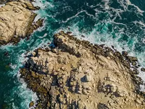 Greenish Prints: Aerial view of Isla Pan de Azúcar in the National Park Pan de Azúcar at the coast of the Atacama desert in Chile