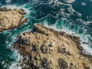Greenish Prints: Aerial view of Isla Pan de Azúcar in the National Park Pan de Azúcar at the coast of the Atacama desert in Chile