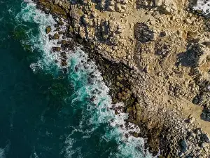 Greenish Prints: Aerial view of Isla Pan de Azúcar in the National Park Pan de Azúcar at the coast of the Atacama desert in Chile