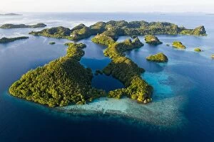 Aerial Landscape Collection: An aerial view of islands in Raja Ampat. This area is the heart of marine biodiversity