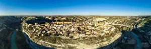 Aerial top down view of the Jucar river surrounding the medieval hilltop town of Jorquera in Spain