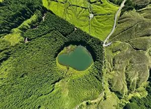 Ponta Delgada Prints: Aerial view of Lagoa do Canario lagoon surrounded by green forest located on Sao Miguel