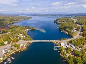 Island Lake Prints: Aerial view of Lake Winnisquam and Winnisquam Sand Bar with US Route 3 bridge between town of Belmont