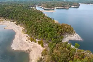 Forestry Industry Prints: Aerial view of landscape of water of Broken Bow lake and islands with forest on the bank