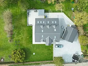 Large Home Prints: Aerial view of a large, recently built house which was built onto a previous bungalow