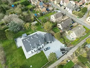 Large Home Prints: Aerial view of a large, recently built house which was built onto a previous bungalow