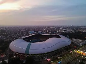 White Bridge Prints: Aerial View of The largest stadium of Bekasi from drone when sunset and noise cloud