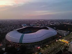 Aerial View of The largest stadium of Bekasi from drone when sunset and noise cloud. Bekasi, Indonesia, March 21, 2021