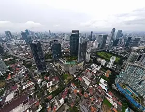 Town Road Prints: Aerial view of Lotte Shopping Avenue building in Jakarta and noise cloud with cityscape