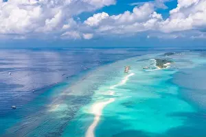 Aerial view on Maldives island. Luxury water and beach villas, bungalows with amazing nature seascape landscape. Luxury travel and vacation