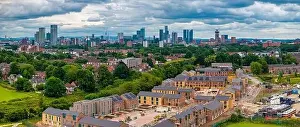 Aerial view of Manchester cityscape with skyscrapers and construction sites