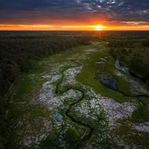 Aerial view of meandering Wymakracz river in sunset light, Poland