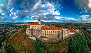 Ludwig Prints: Aerial view of medieval castle on mountain in small european city in autumn season