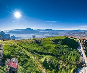 Trikala Prints: Aerial view of monastery of landmark canyon of Meteora and breathtaking picturesque valley at sunset