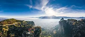 Trikala Prints: Aerial view of monastery Trinity and breathtaking pictures of valley and landmark canyon of Meteora at sunset