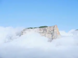St Martin Prints: AERIAL VIEW. Mont Aiguille, an isolated limestone butte emerging from a sea of clouds