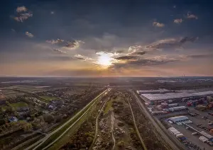 Sunset Landscape Prints: Aerial view of Moorburg in Hamburg at the Altenwerder container terminal at sunset