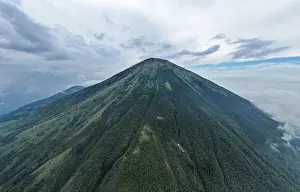 Central Java Prints: Aerial view of Mount Sindoro in Indonesia with noise cloud