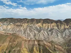 Aerial view mountain over blue sky. Drone view mountain valley. Beautiful view from above surface of mountain hills