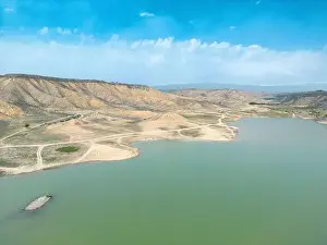 Aerial Lake Prints: Aerial view on mountain lake. Drone view water reservoir at mountain valley
