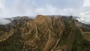 Toledo Prints: From above aerial view of mountain peaks valley located near calm rive in Barrancas de Burujon in Toledo
