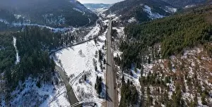 Aerial view on mountain road from drone in winter