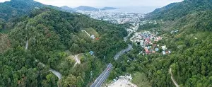 Travel Asia Prints: Aerial view of mountain road in forest in autumn season Top view from drone of curve road Colorful landscape with