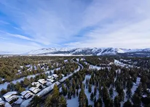 An aerial view of the mountain town of Mammoth Lakes, California during a snowy winter