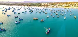 Commercial Dock Prints: Aerial view of Mui Ne fishing village in the morning with hundreds of boats anchored to avoid storms