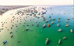 Aerial view of Mui Ne fishing village in the morning with hundreds of boats anchored to avoid storms