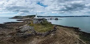 Aerial view of the Mumbles headland with the historic lighthouse and piers in Swansea Bay