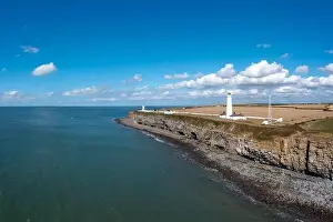 Rocky Beach Prints: Aerial view of the Nash Point Lighthouse and Monknash Coast in South Wales
