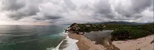 Treetop Prints: Aerial view of nature, hills, and beach of Los Naranjos in Santa Marta by Tayrona National Park in Colombia