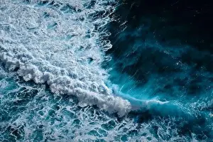 Turbulence Prints: Aerial view to ocean waves. Blue water background