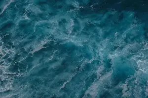 Turbulence Prints: Aerial view to ocean waves. Blue water background