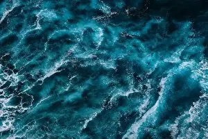 Turbulence Prints: Aerial view to ocean waves. Blue water background. Dramatic colors photo