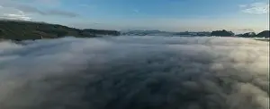 Aerial view Panorama of flowing fog waves on mountain tropical rainforest