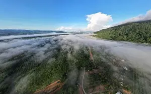 Sunset Sky Prints: Aerial view Panorama of flowing fog waves on mountain tropical rainforest