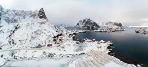 Morning Mountain Prints: Aerial view, Panorama, Lofoten islands with fishing village on coastline in gloomy on winter at Norway